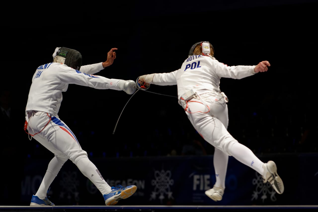 Adult epee fencers competing in World Championship team bout