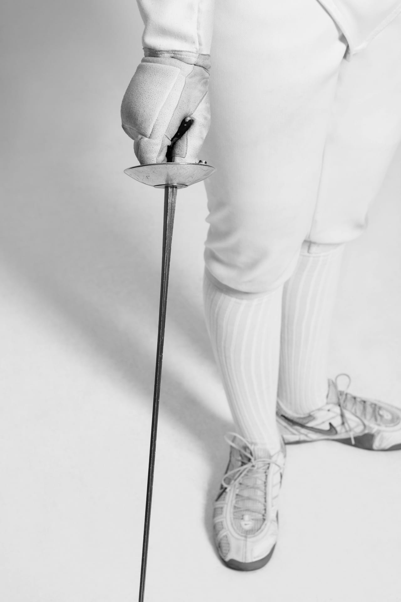 Close-up of fencer holding fencing sword