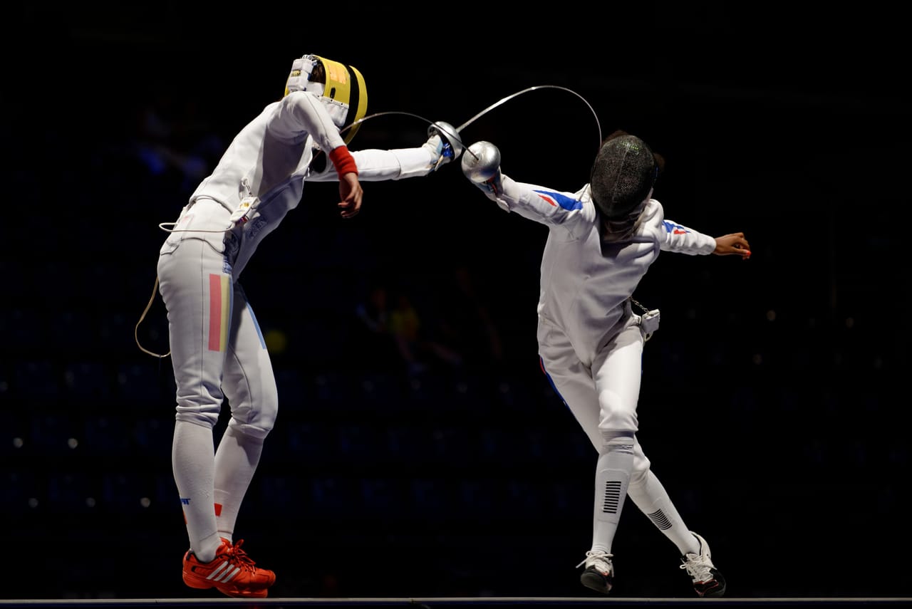 Two epee fencers in competitive World Championship bout